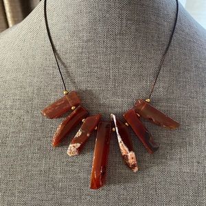 Gorgeous rough carnelian gemstones hand made on a brown leather cord.